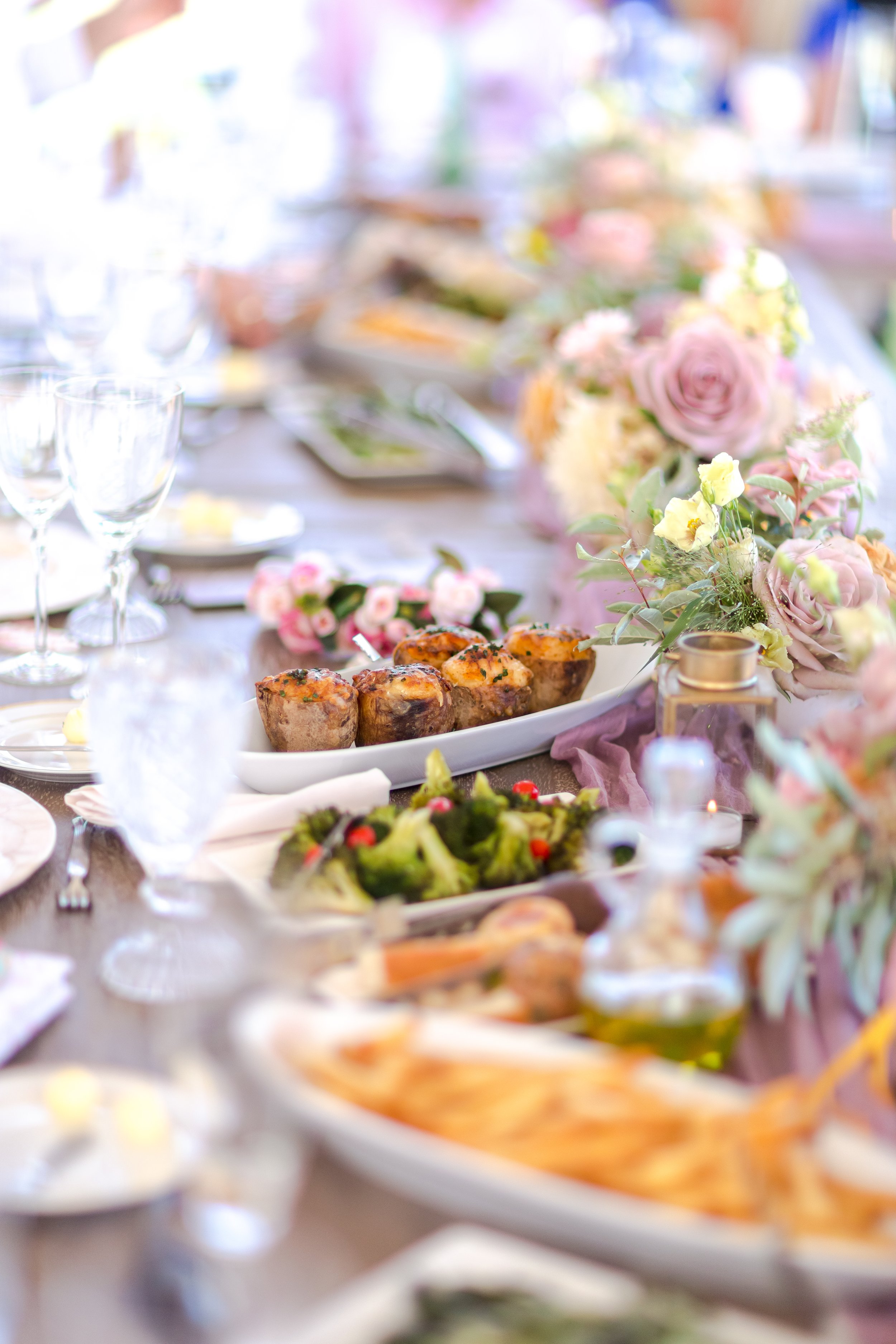 Editorial baby shower table styling with lavender accents and layered linens