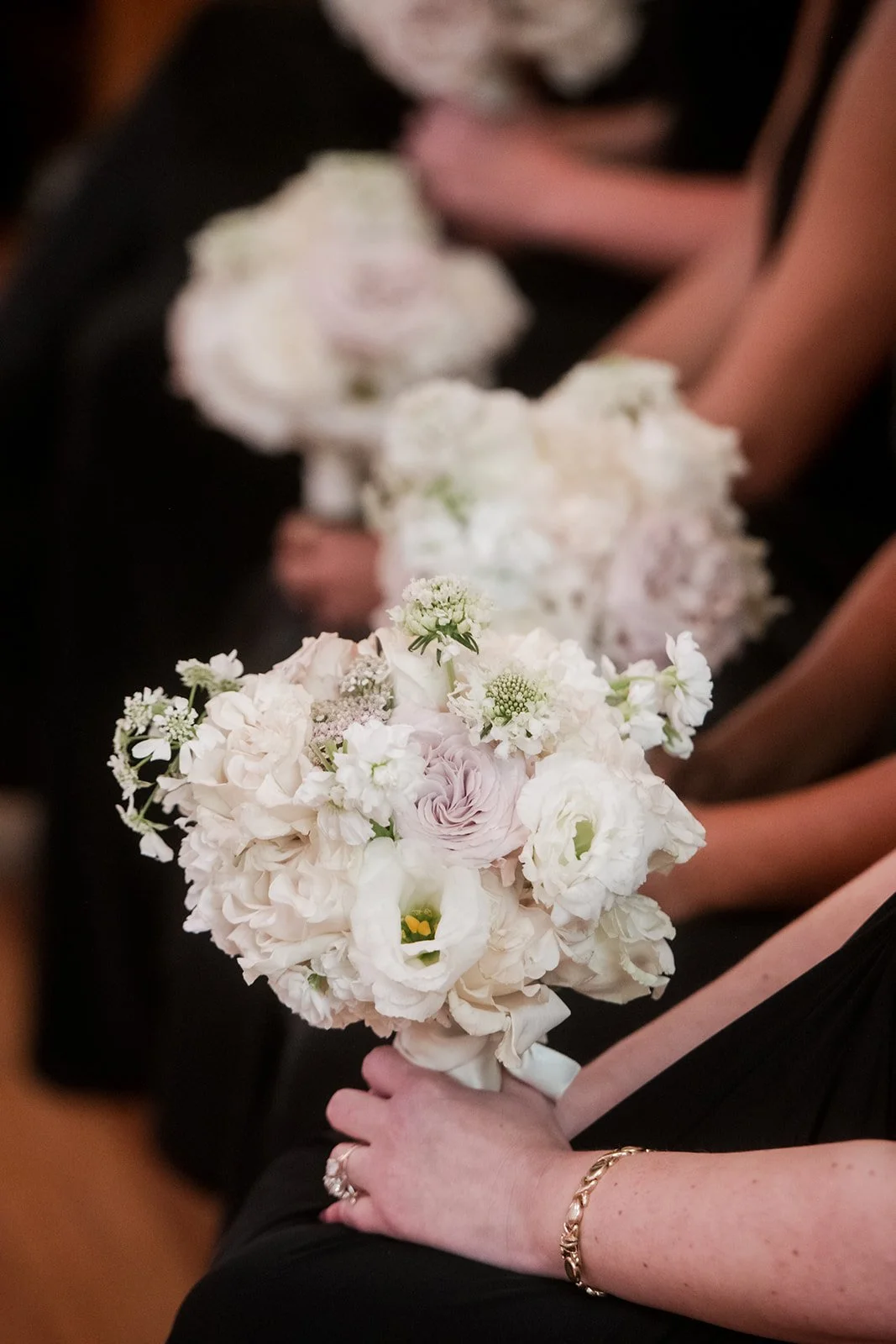 Sustainable wedding floral design with ceremony florals repurposed into the reception.