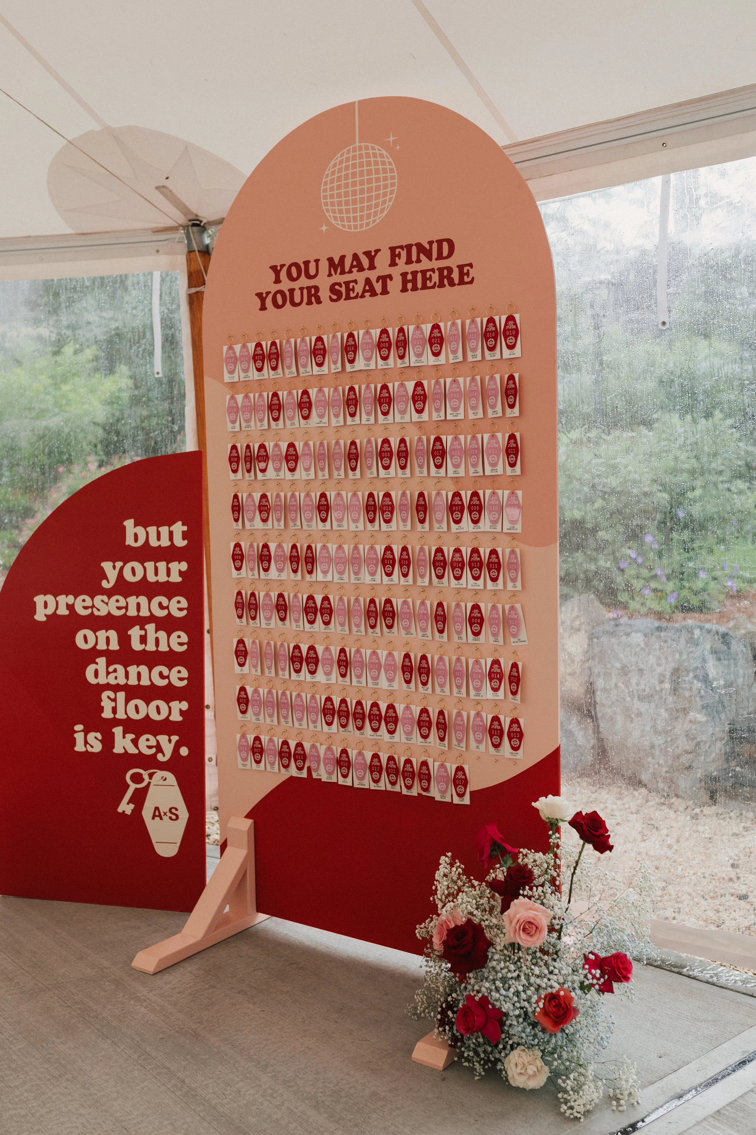 Graphic wedding escort cards designed as hotel room keys for a playful, modern wedding.