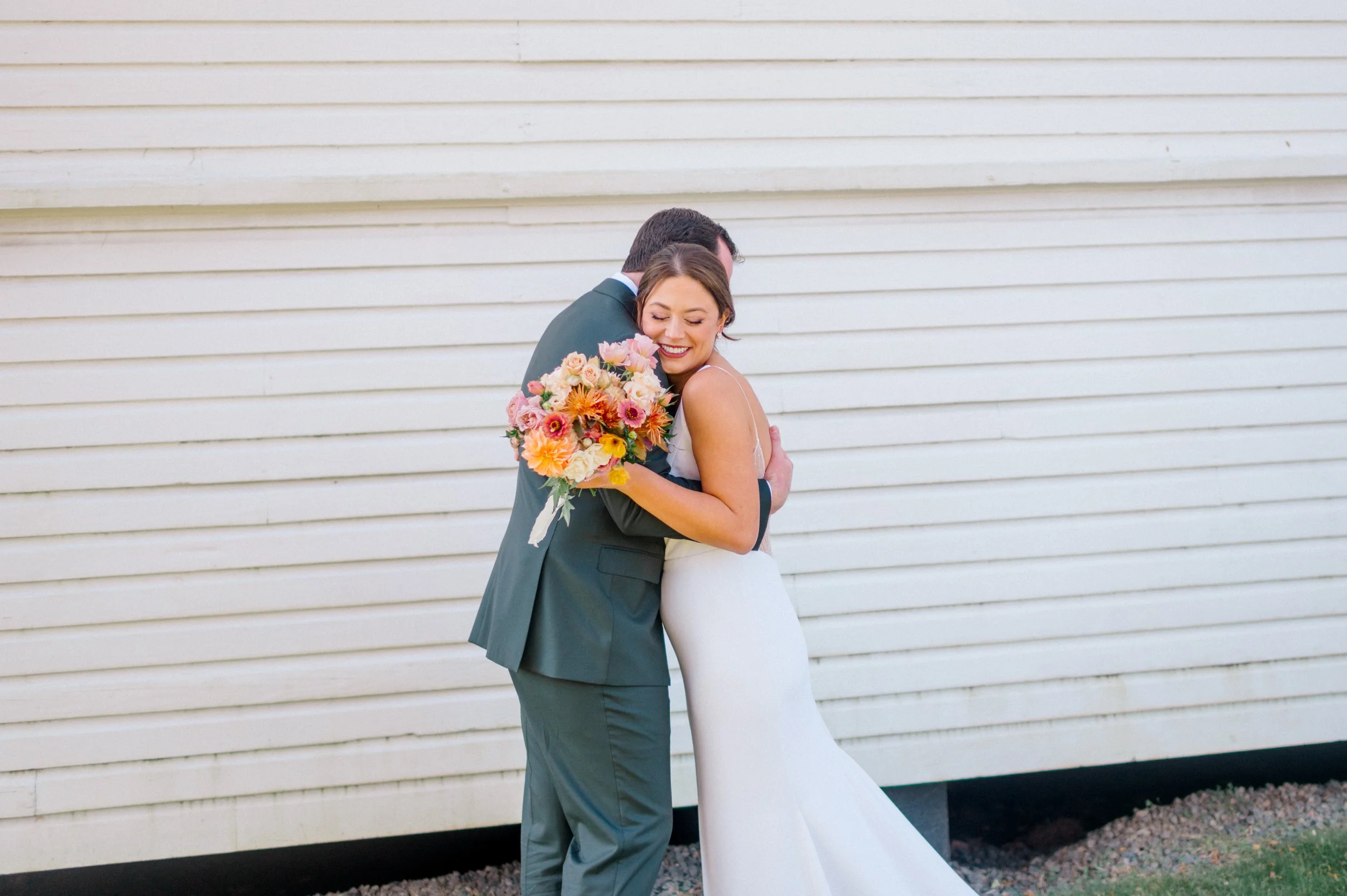 Close-up of fall bridal bouquet with layered textures and warm autumn tones.