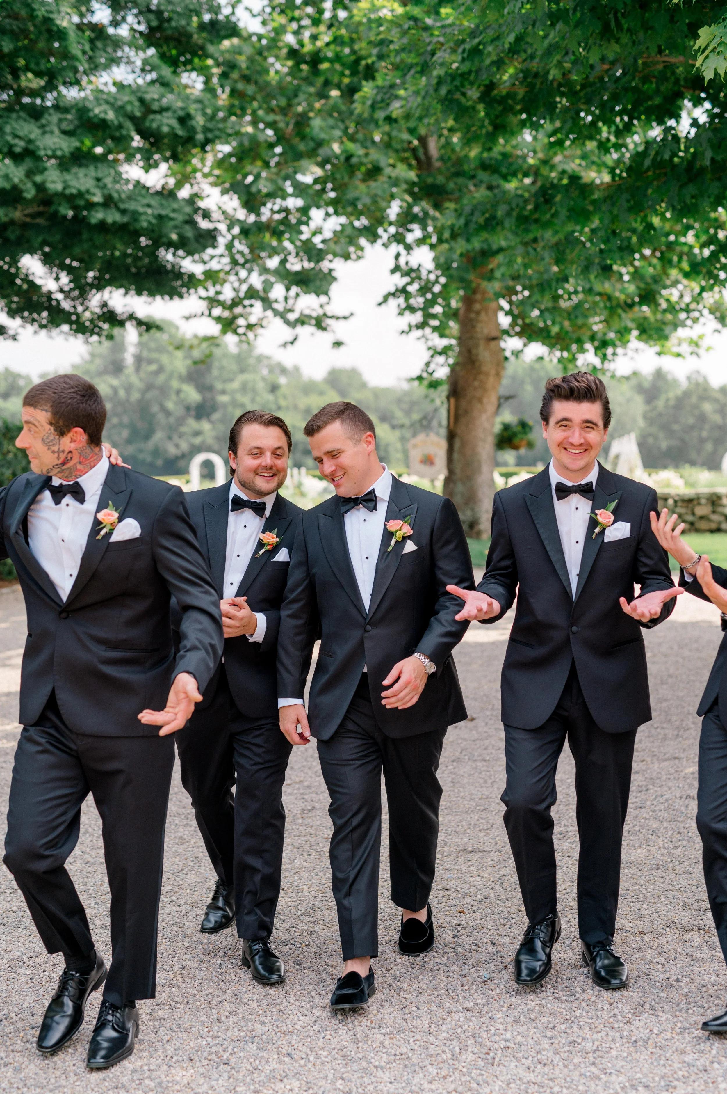 Modern boutonnière featuring yellow butterfly ranunculus and raspberry scabiosa.