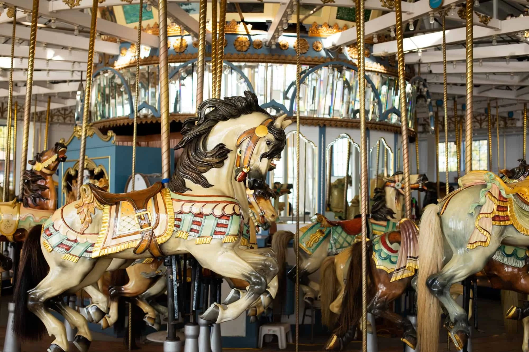 Hand-carved antique carousel horses at the Lighthouse Point Park carousel, a historic wedding