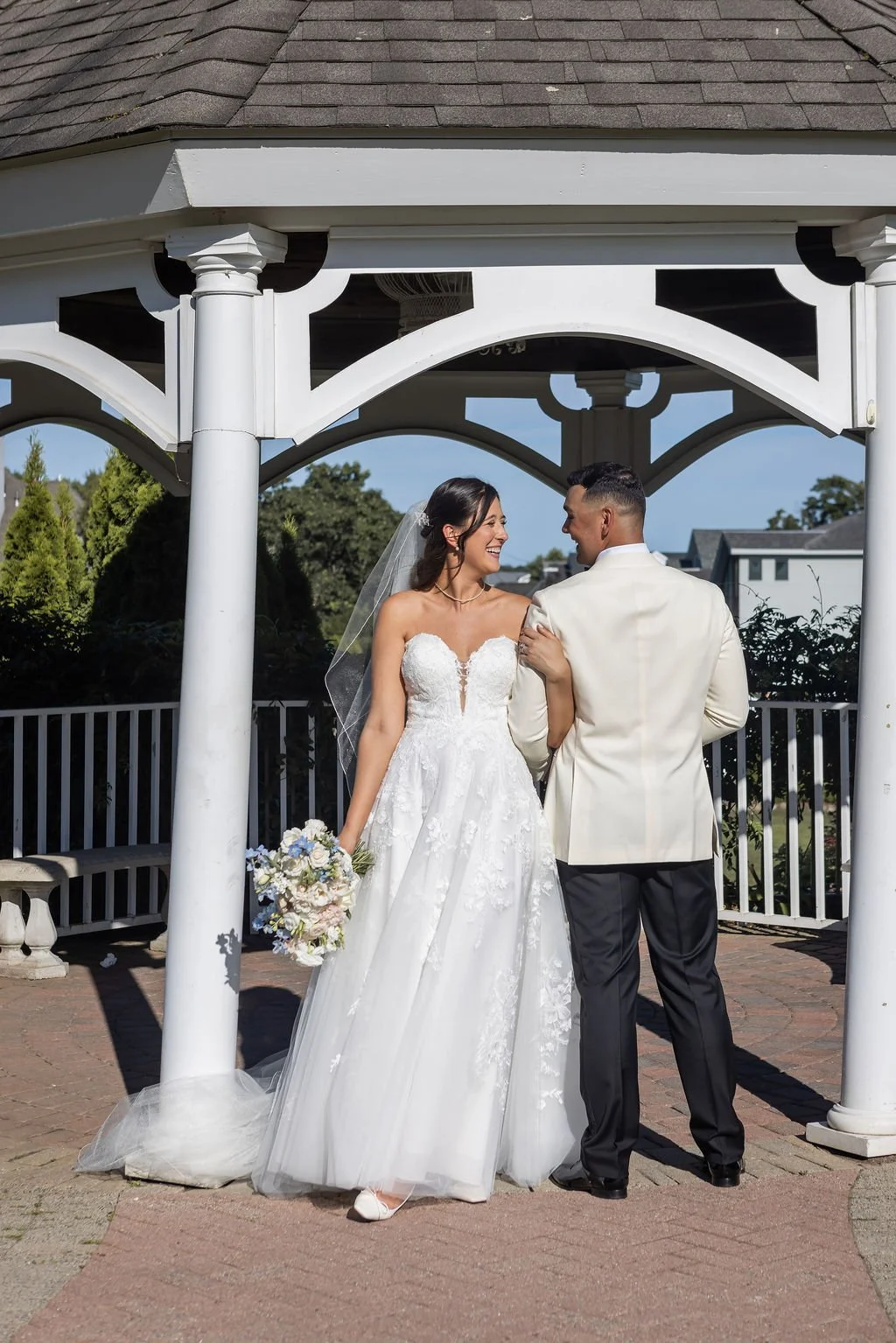 Bride and groom first look moment on the grounds of Water's Edge Resort and Spa in Westbrook Connecticut