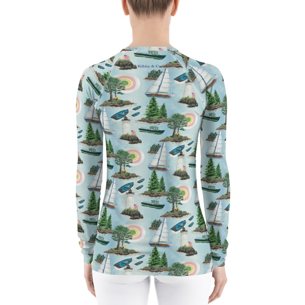 Maine Isles Toile pattern in nautical coastal print. Kibby & Co. in pink, green, yellow, and blue. Long-sleeve crew neck rash guard. Preppy print. Sail boats, islands, light house, sun sailing shirt