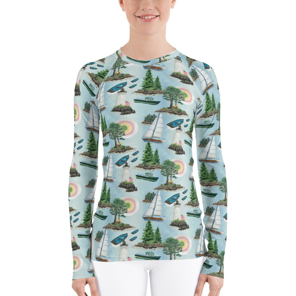 Maine Isles Toile pattern in nautical coastal print. Kibby & Co. in pink, green, yellow, and blue. Long-sleeve crew neck rash guard. Preppy print. Sail boats, islands, light house, sun sailing shirt