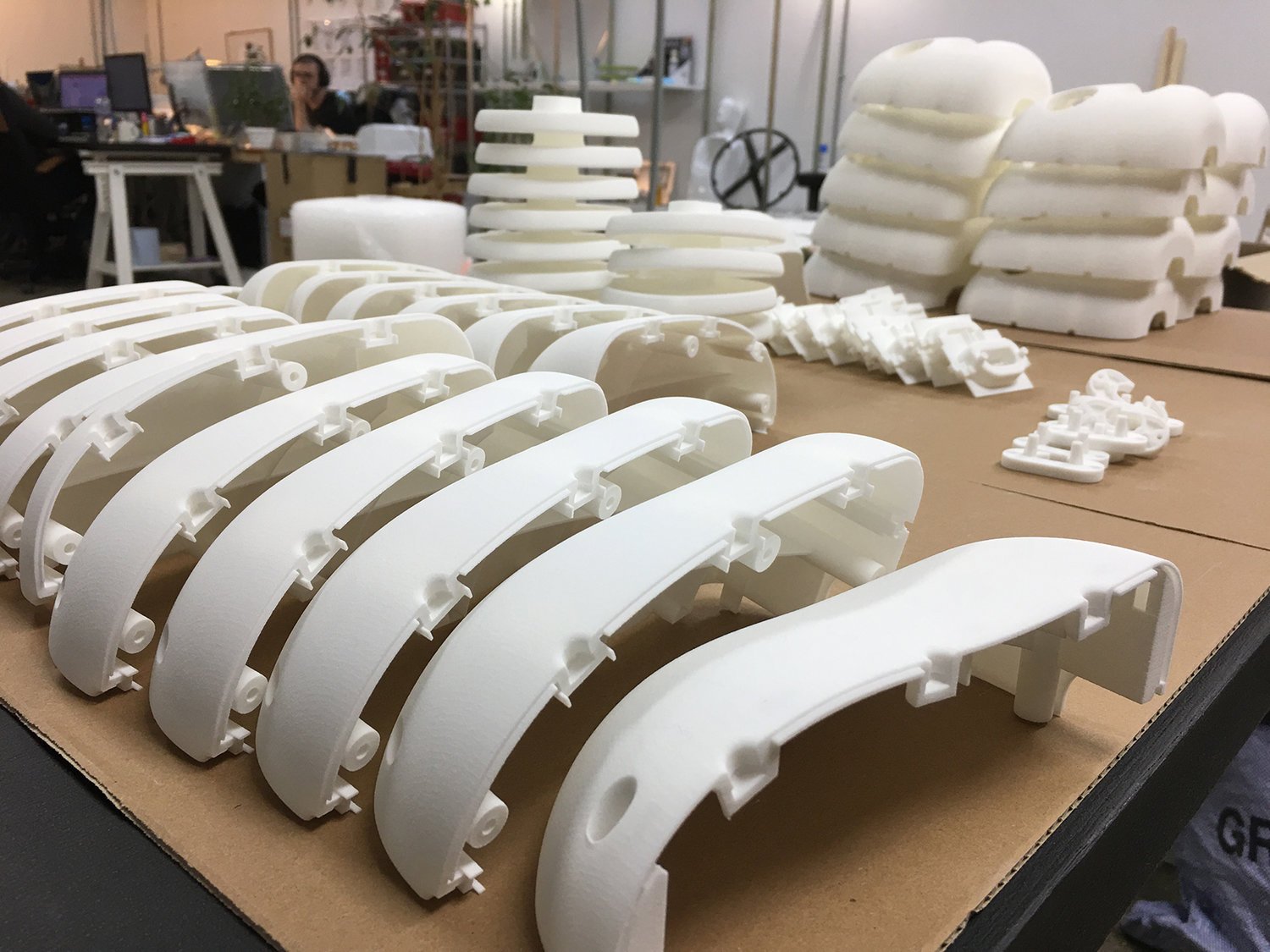 Pre-painted, SLS nylon 3D prints.