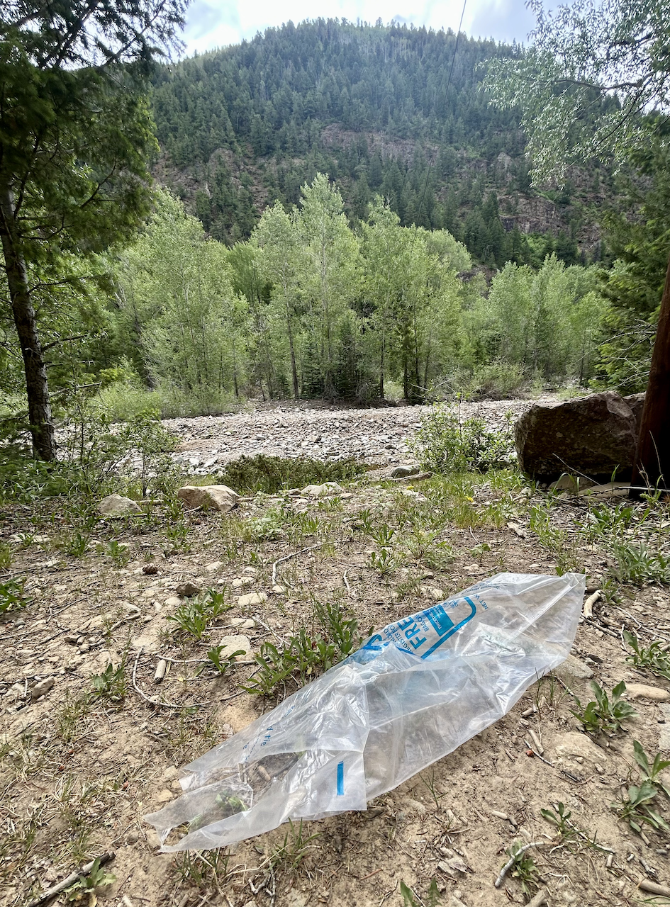 A plastic ice bag on the bank of a dry creaked in La Plata Canyon.
