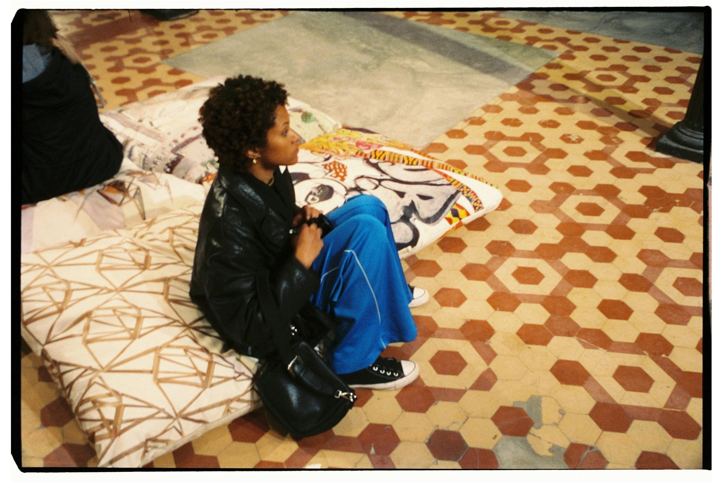 black woman sitting looking away