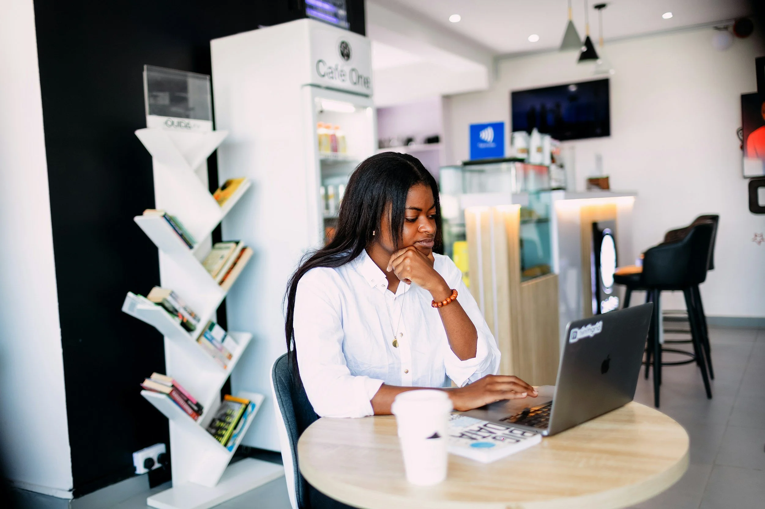 Woman looking down at laptop