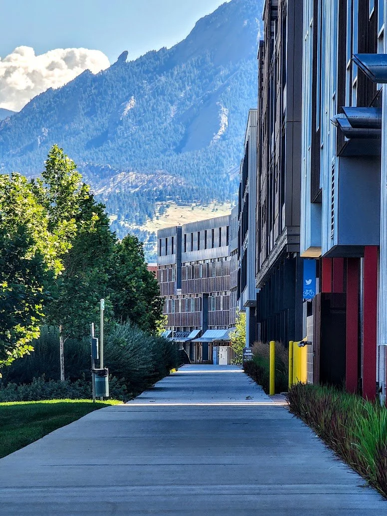A series of condos and apartments in Boulder Junction with the Flatirons in the background