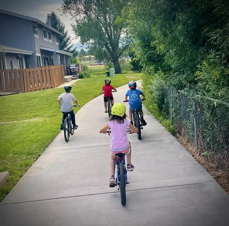 Kids biking on a Boulder multi-use path