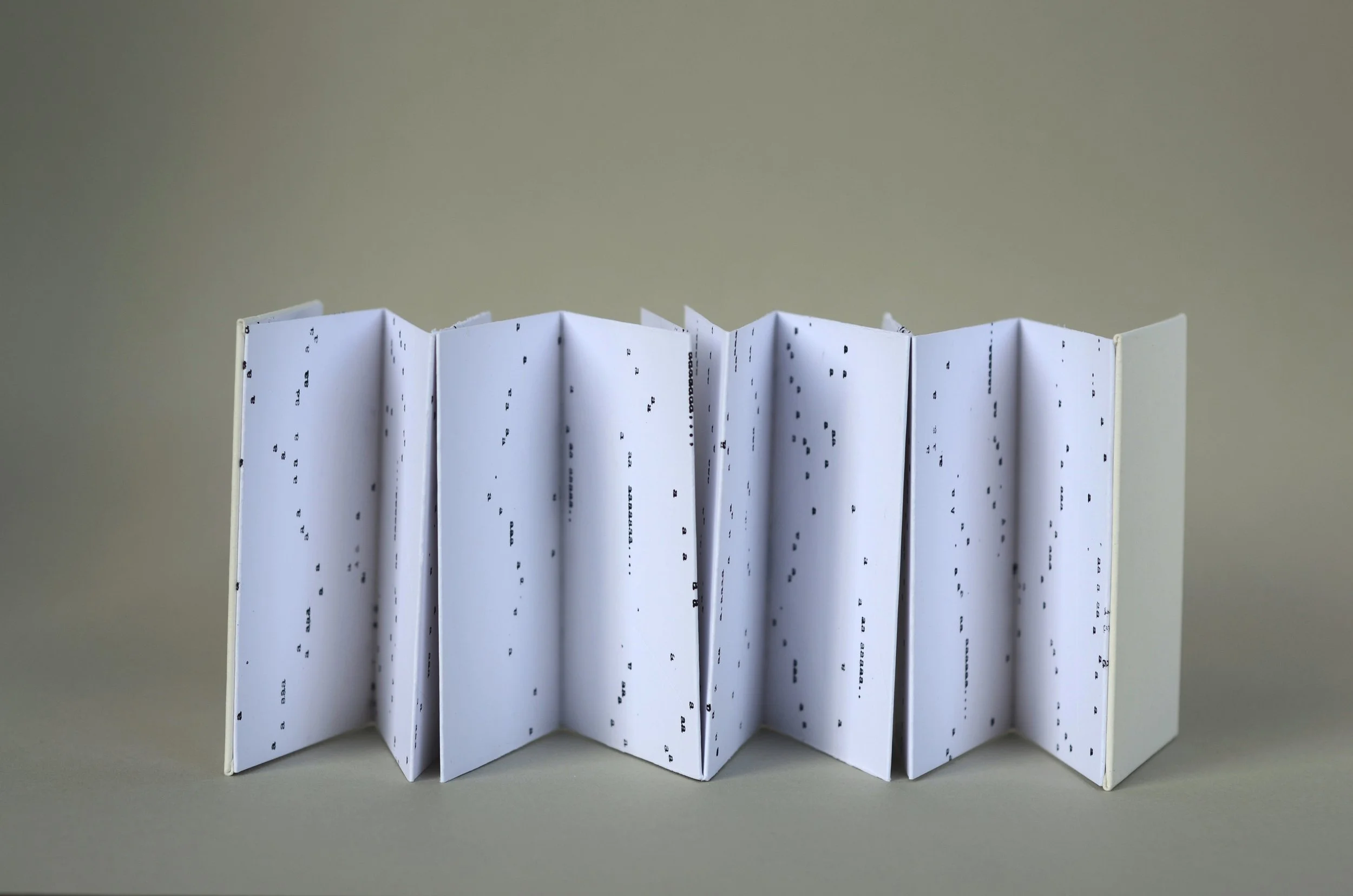 Bigger on the Inside 3 , handmade artist book, screen ink, stamp ink, embossment on Cougar paper (back)