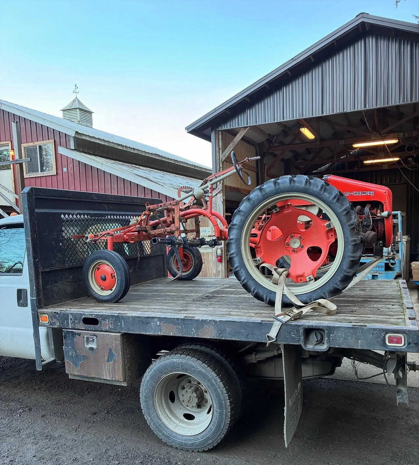Hauling the old &ldquo;G&rdquo; cultivating tractor into the barn for winter maintenance.