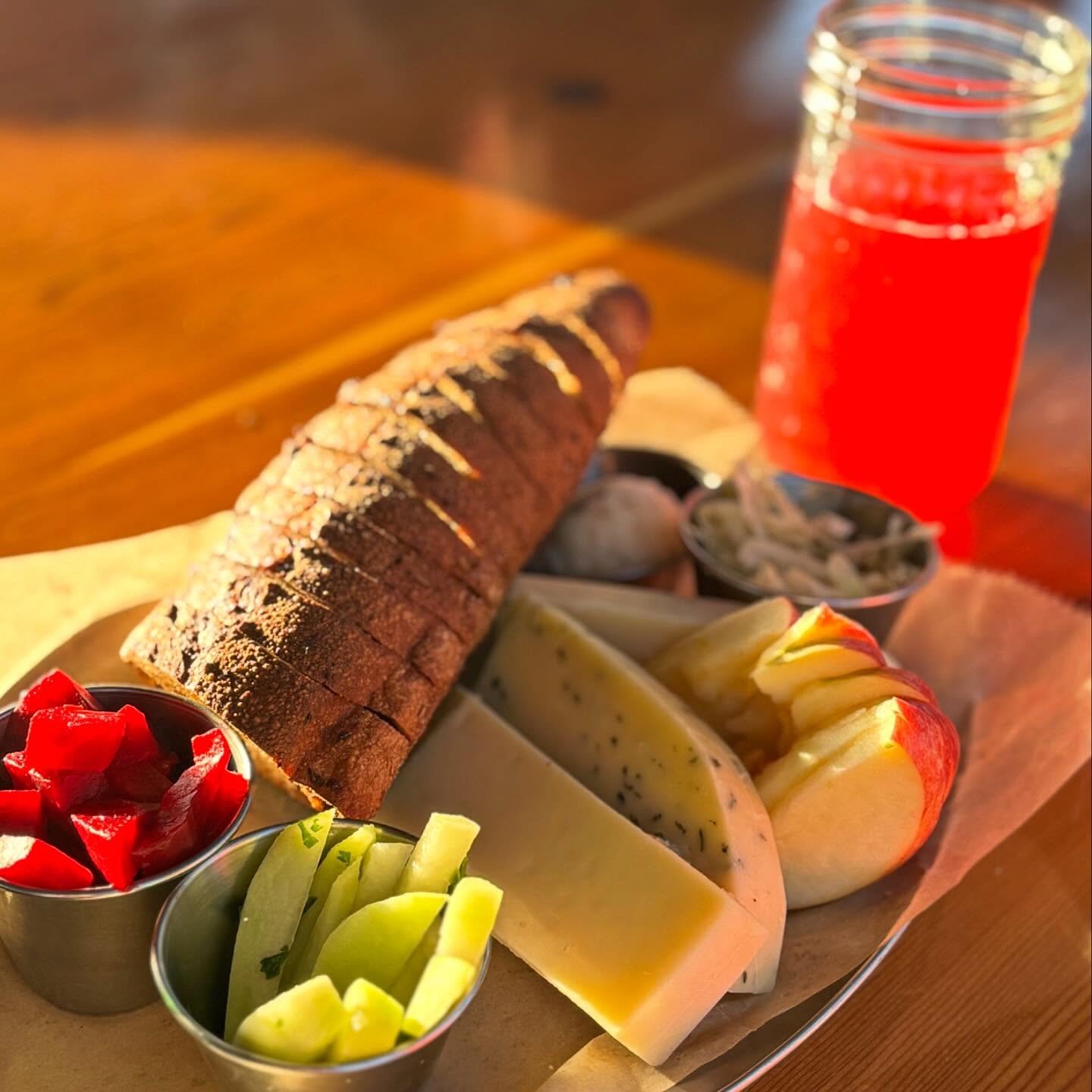 FARM &amp; FIELD BREAD PLATE hits the spot. Served at Finnriver Farm &amp; Cidery up the road, with our locally grown &amp; baked Chimacum Valley Grainery Baguette with Samish Bay cheese, house made compound butter, and seasonal veggies and fruit. Ce