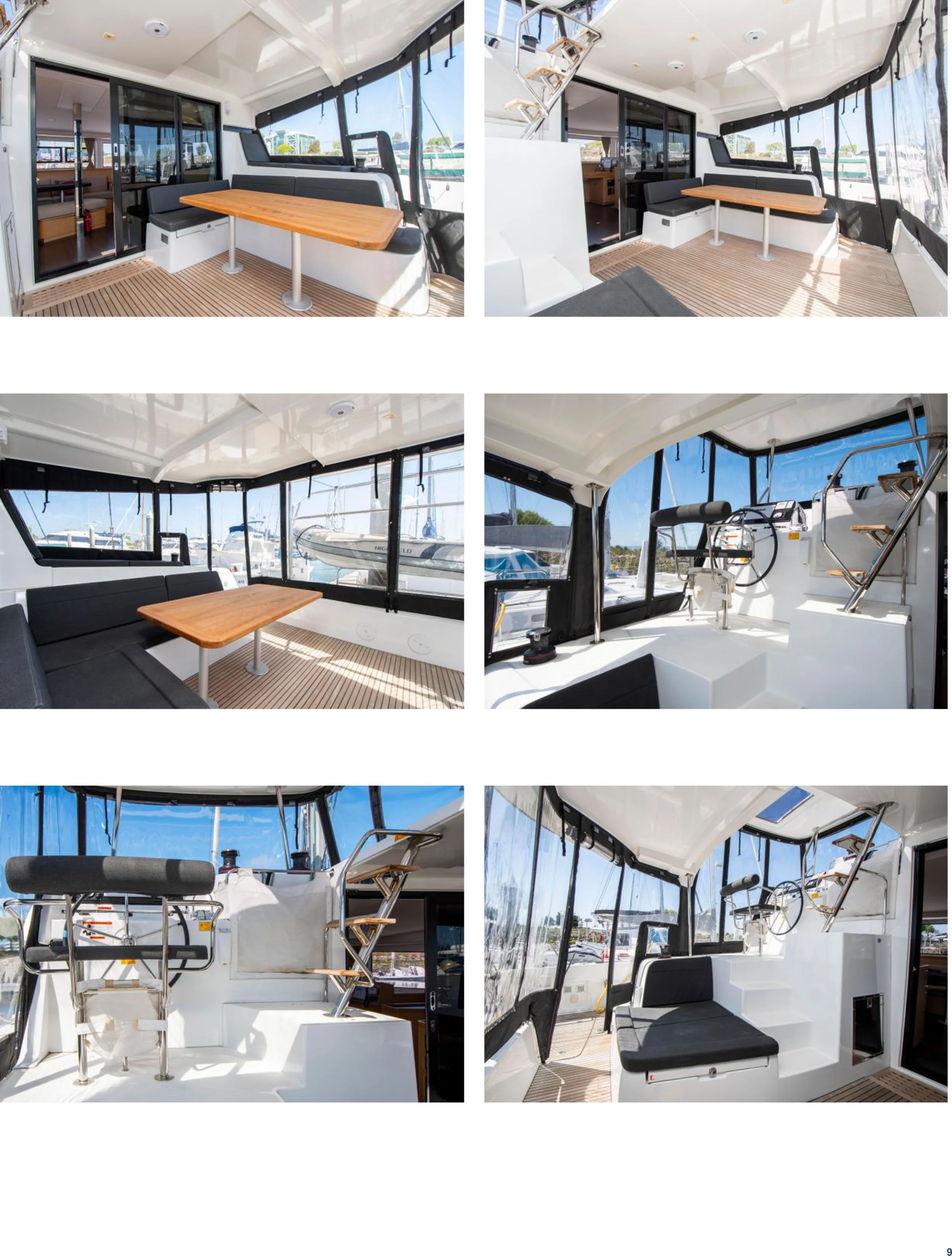 Interior of a boat with seating, tables, and navigation control area, docked at a marina on a sunny day.