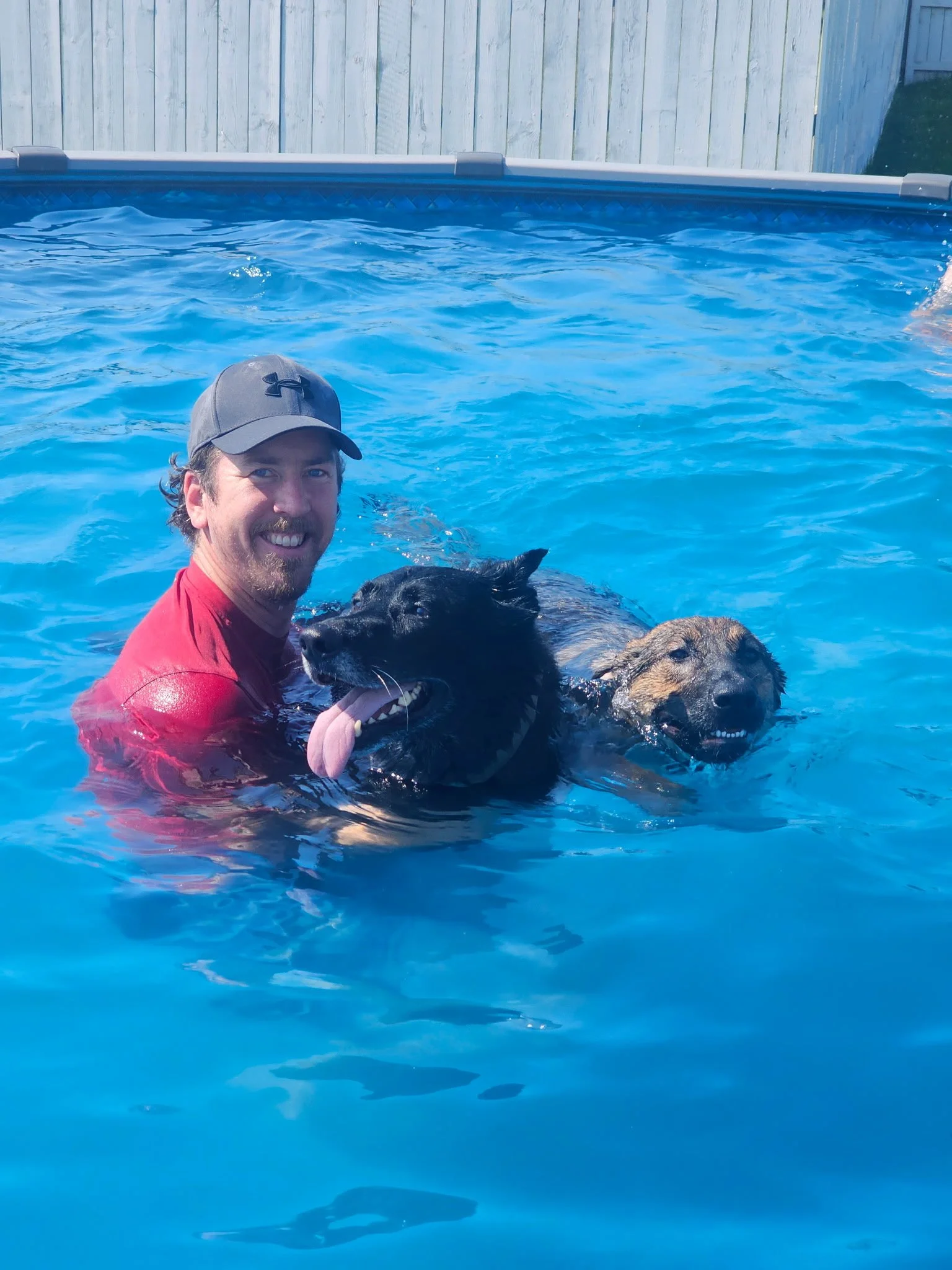Left to right; Pat and his Police Service dog Rhaegar of Sapphire Mountain with his young dog Saber in training.