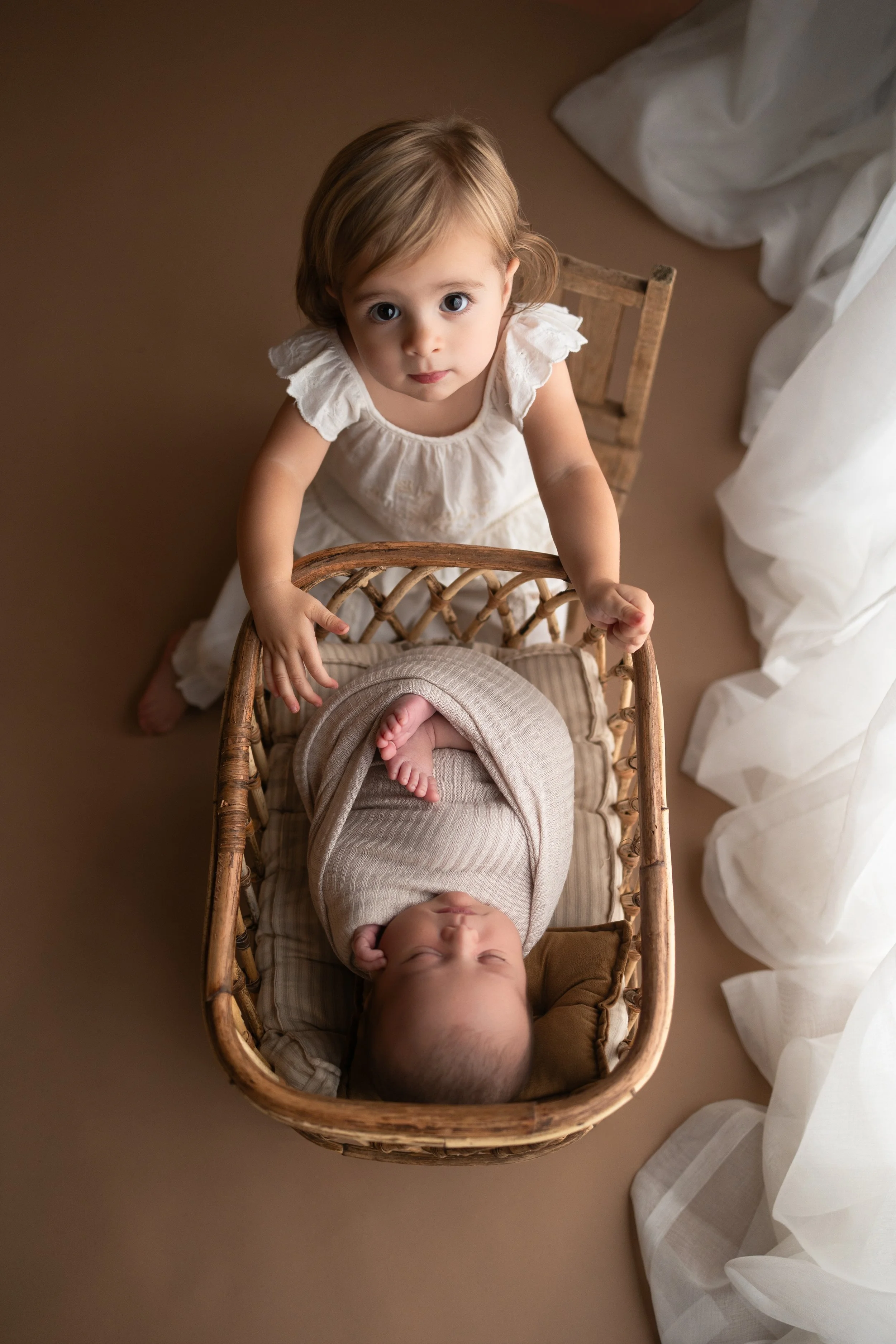 Lifestyle newborn and sibling photography in Dahlonega GA, creating timeless baby portraits for families throughout Alpharetta, Milton, Cumming and North Georgia.