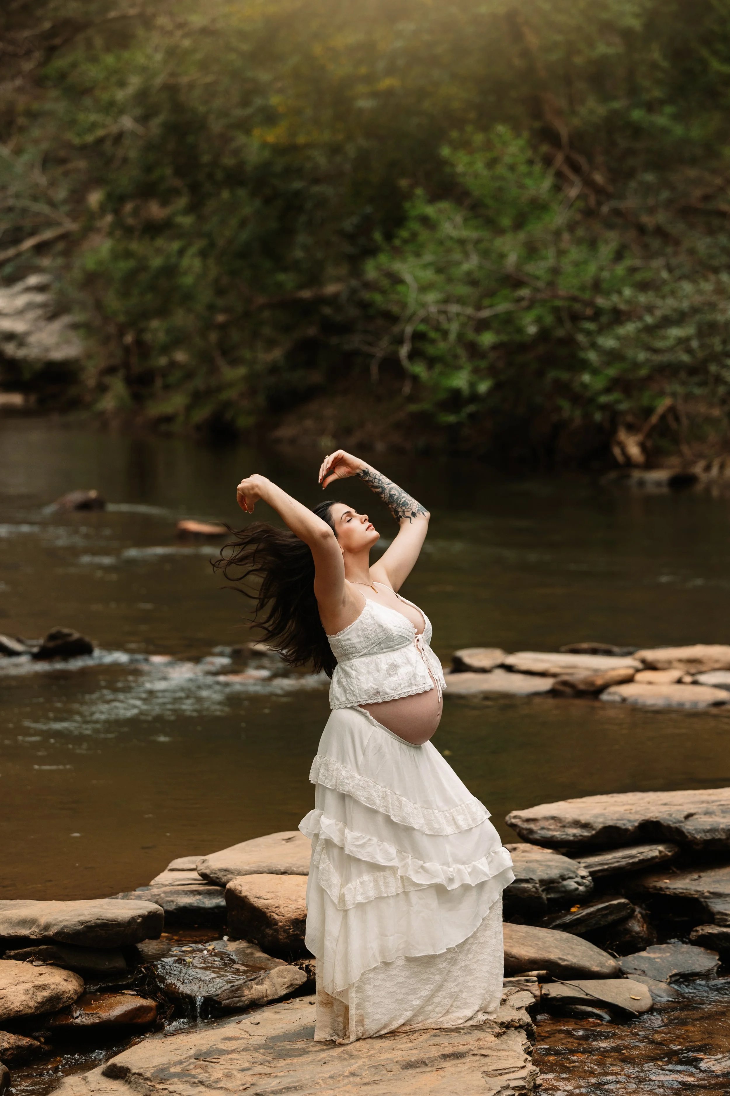 North Georgia maternity photographer creating artistic pregnancy portraits by the river near Dahlonega, serving Cumming, Milton and Alpharetta