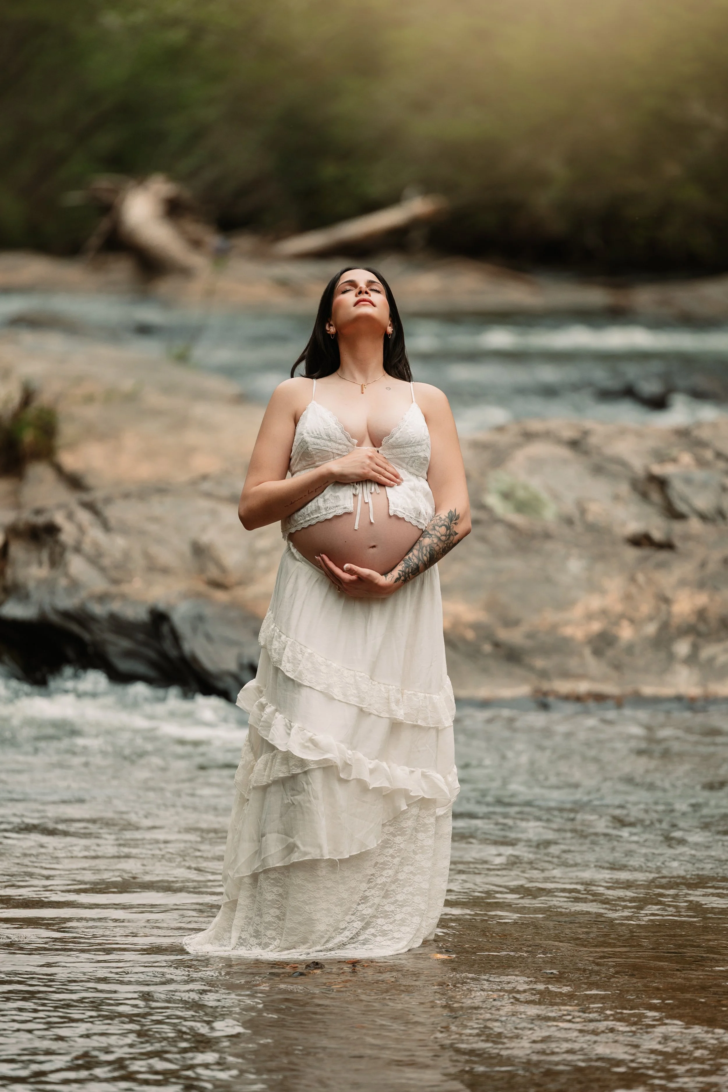Outdoor Fine art maternity photography in North Georgia featuring an expecting mother in a river near Dahlonega, serving Milton and Alpharetta GA. Maternity in the river