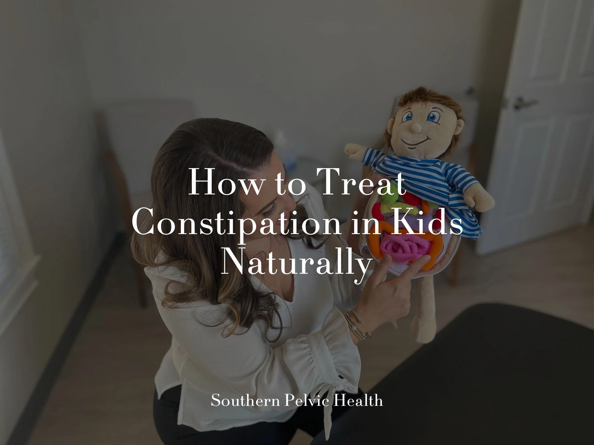 Pediatric physical therapist at Southern Pelvic Health with a pediatric model