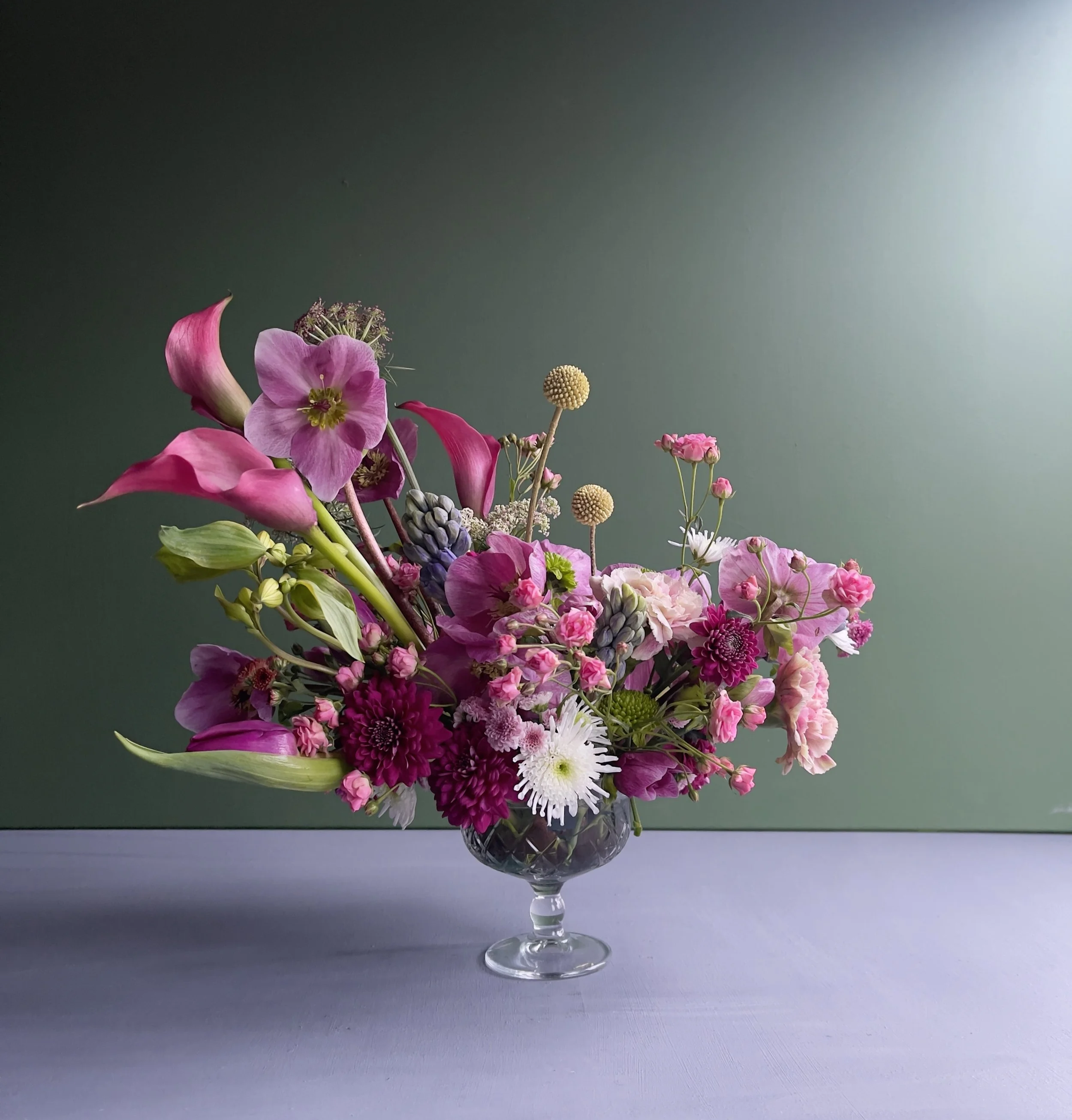 Flower arrangement in pink, magenta and burgundy