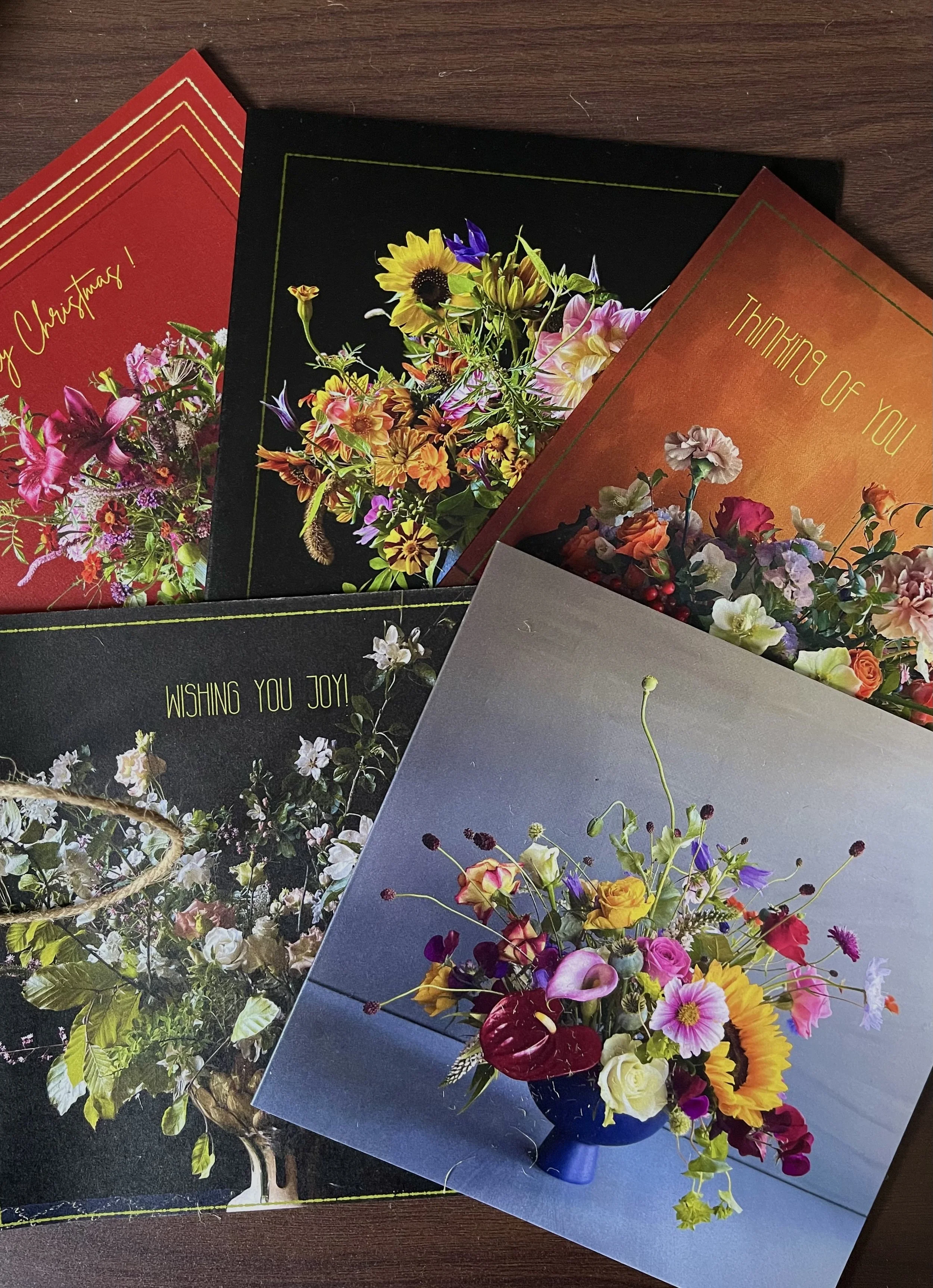 Five different floral greeting cards spread out
