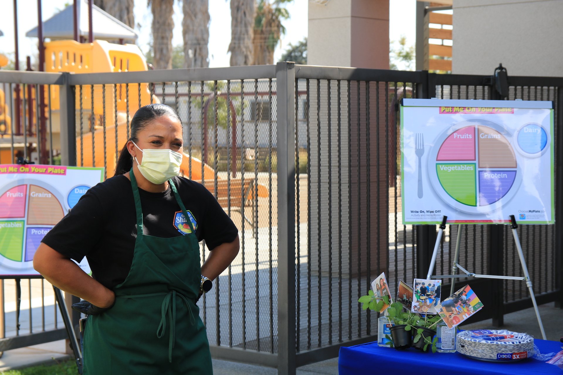 A Metro staff member speaks with Healthy Futures staff during a cooking class demonstration