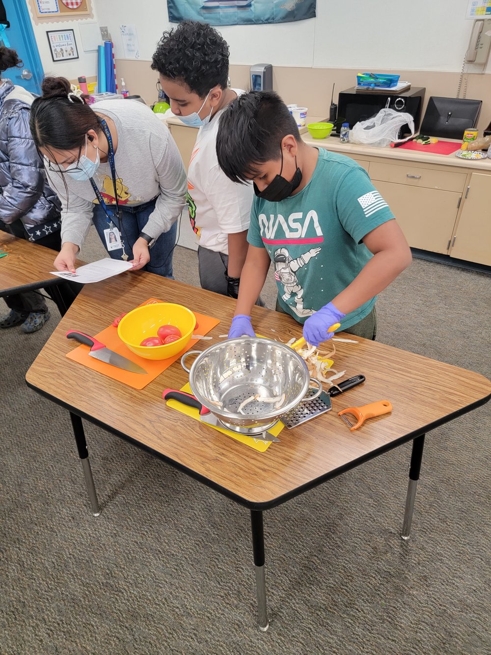 Students preparing a recipe during a Cooking Matters class