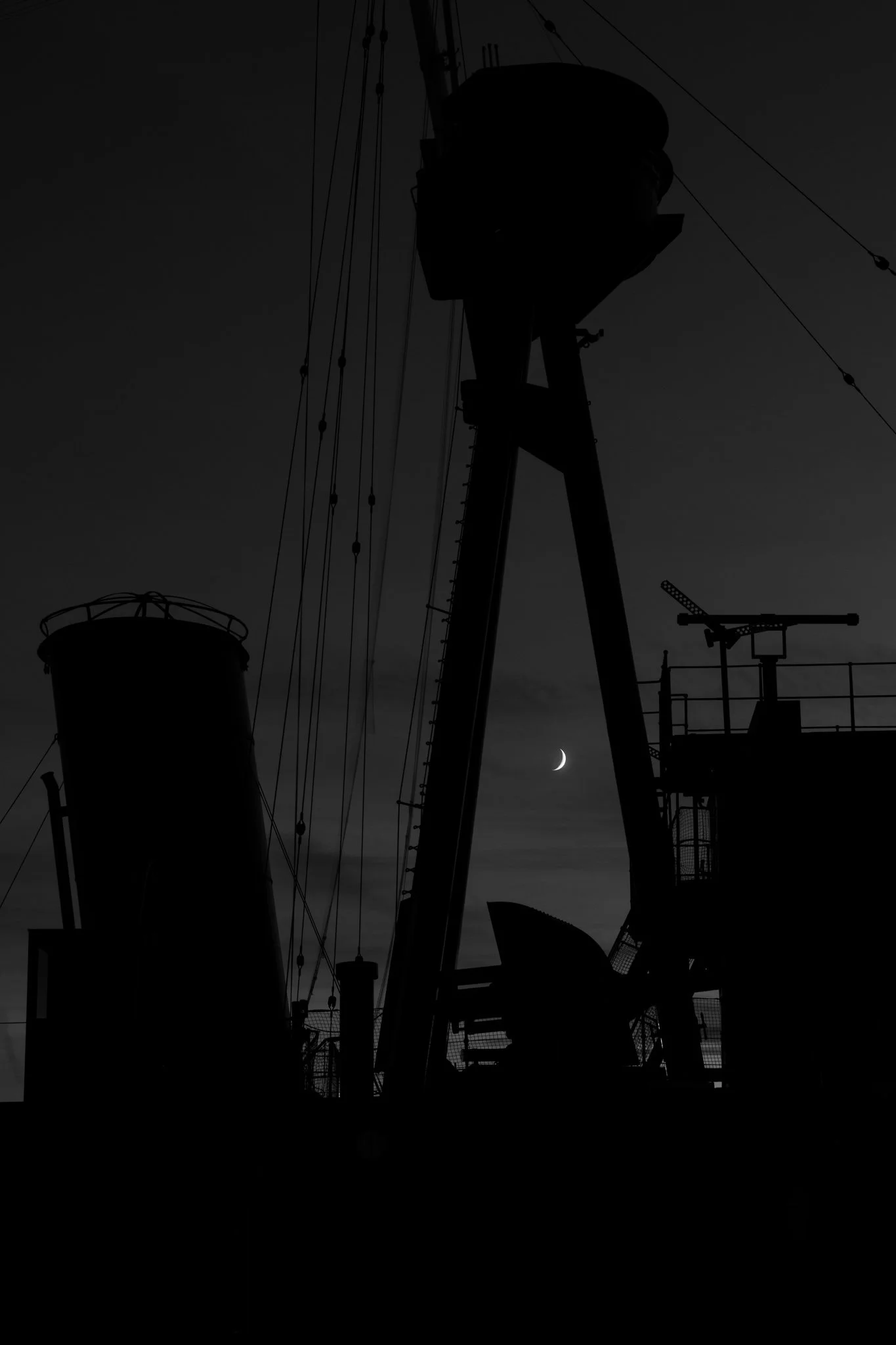 HMS Caroline, Belfast at night with crescent moon