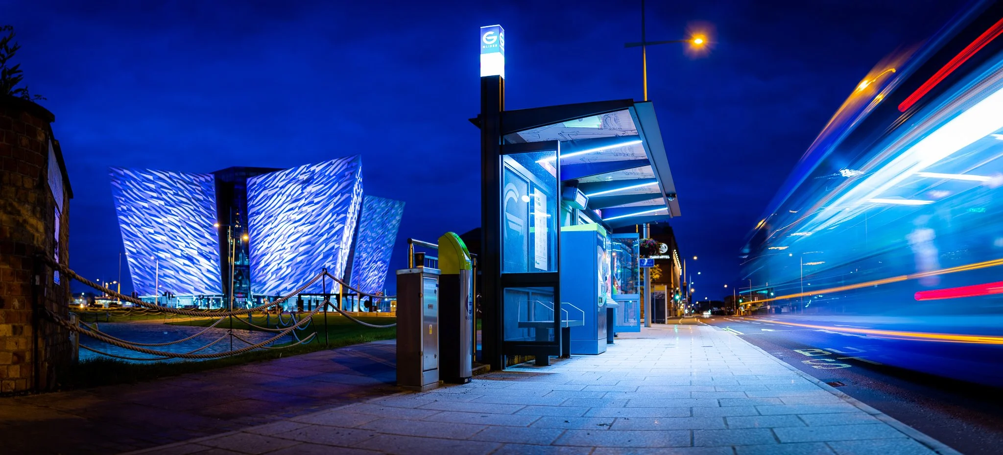 Titanic Belfast with bus at night