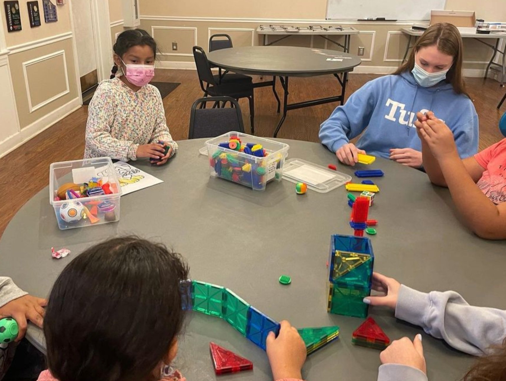 Playing with sensory toys such as blocks, fidget toys and legos to help ease stress & anxiety!