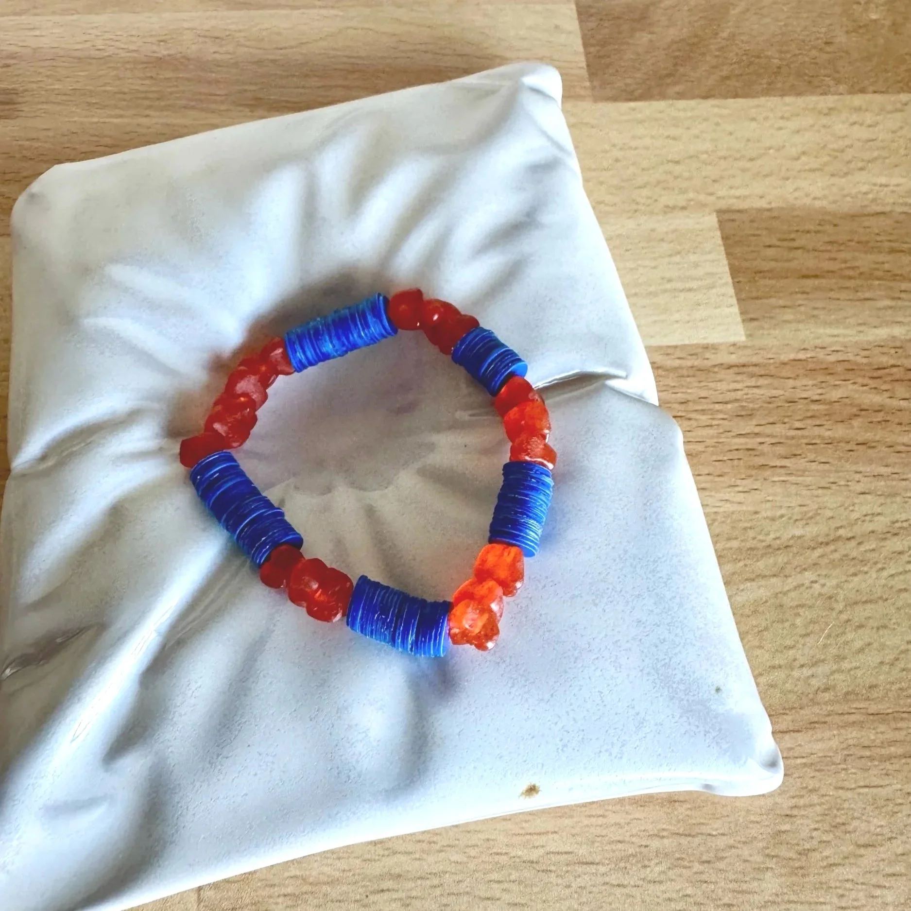 orange and blue glass stretchy bracelet. team spirit