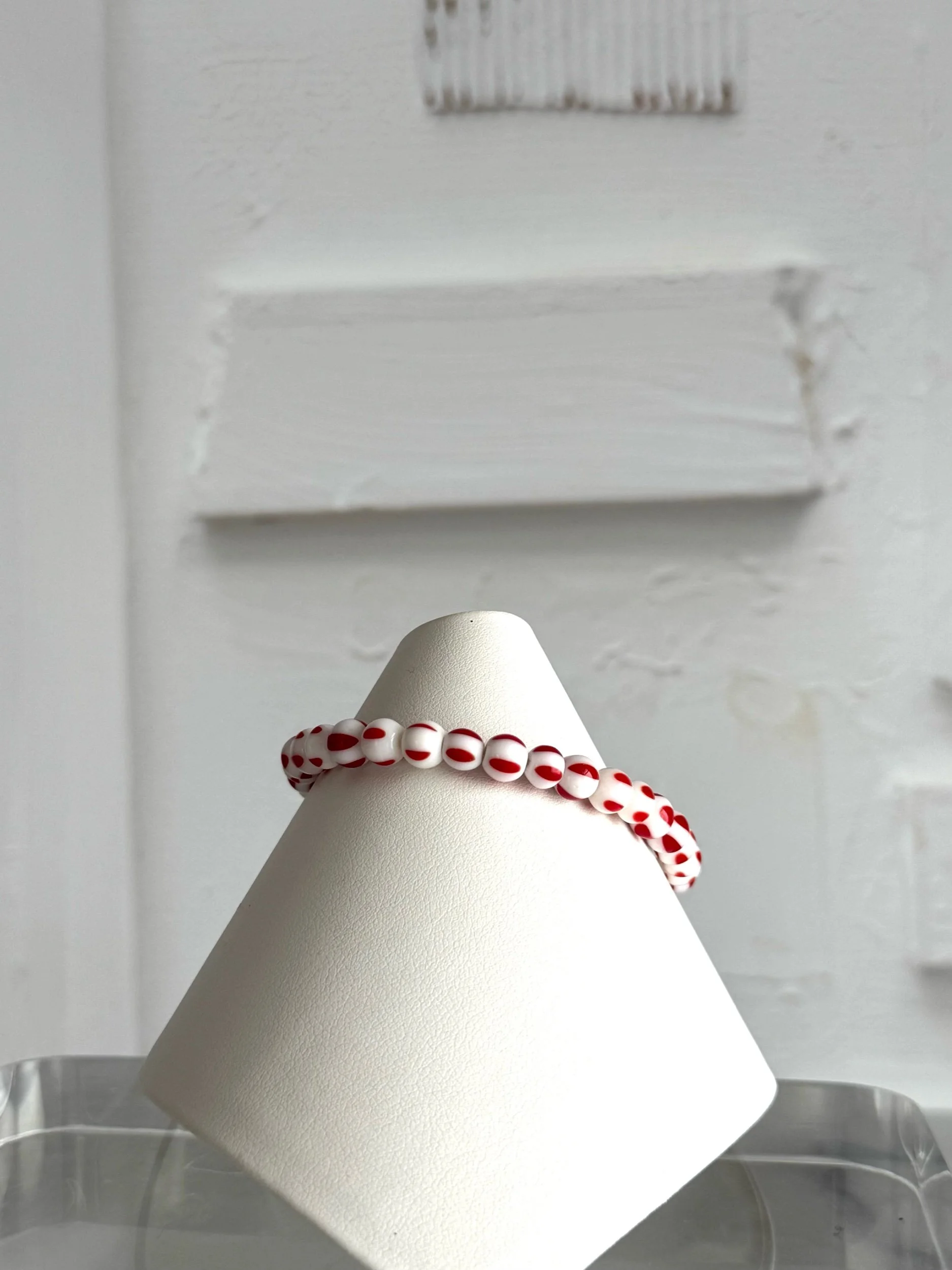 red and white stripe square lucite bead bracelet with red and white glass bead.
