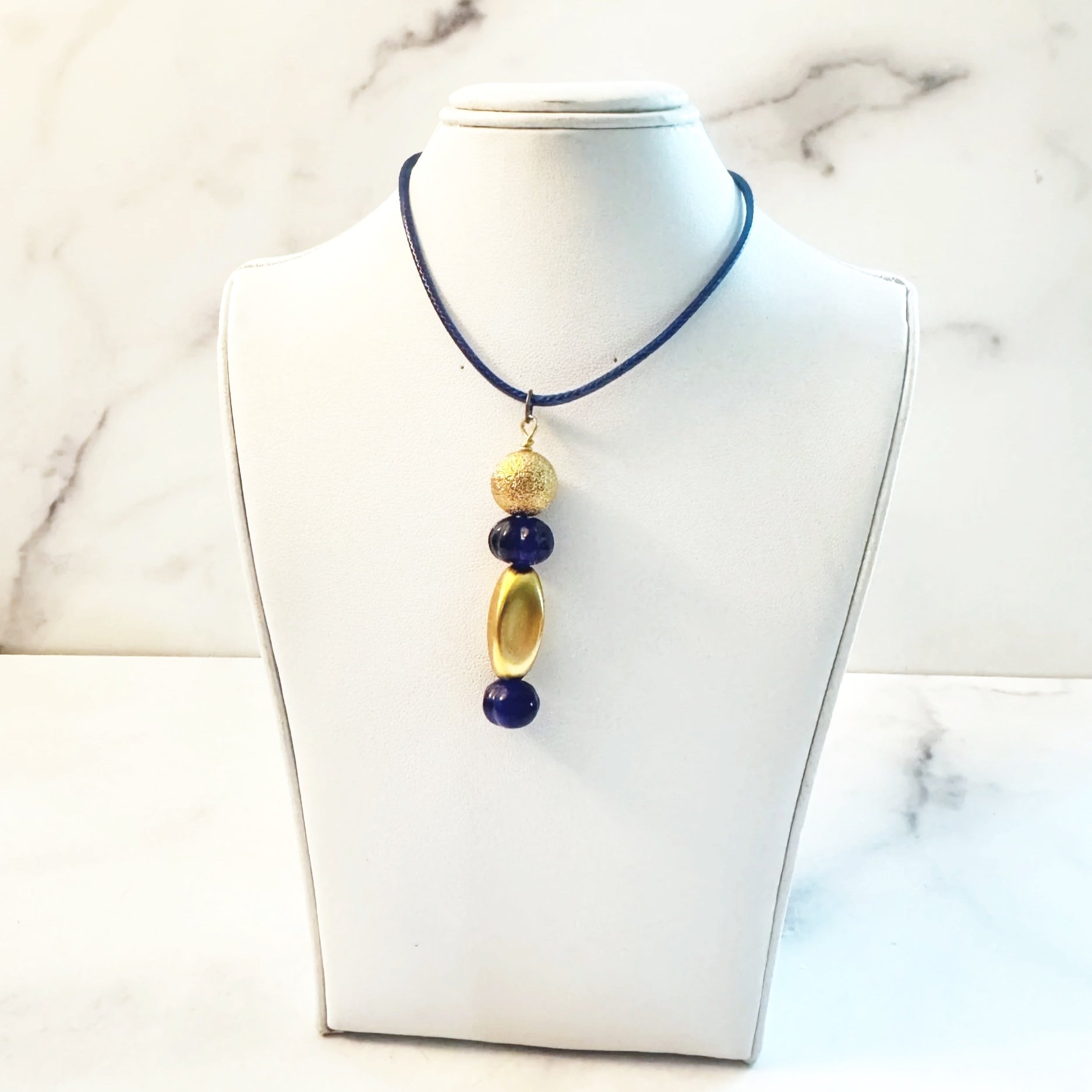 navy and gold vintage bead necklace on cloth cord