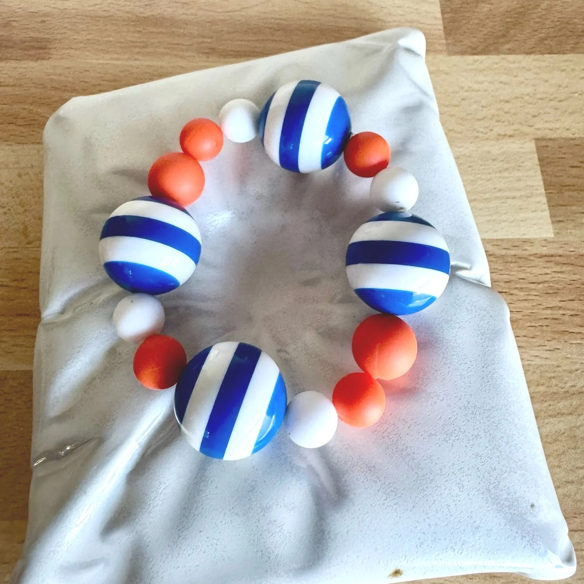 orange and blue stretchy bracelet NY team colors