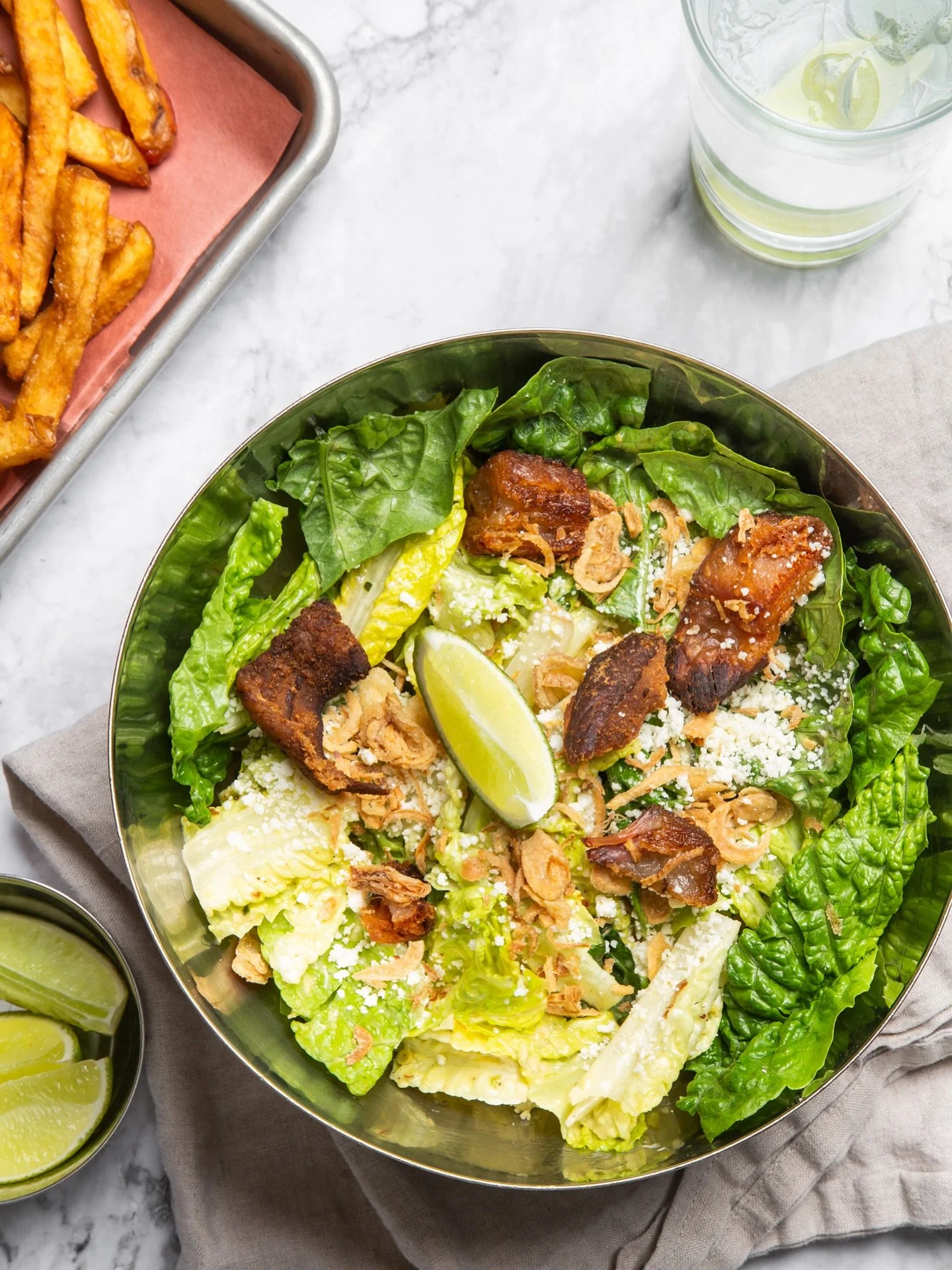 Chadwick’s Legendary Caesar Salad 🥗 
Crisp romaine leaves tossed with crumbled cotija cheese, crispy
shallots, bacon chicharron
and finished with our house-made dressing 🤤 
(*dressing contains anchovies).
Find it tonight on our BIG SIDES me