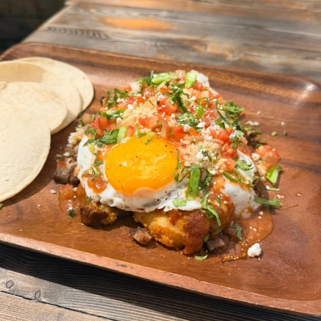 This weekend&rsquo;s feature: Huevos con Mole 🍳

Potato hash, chopped brisket, eggs your way, and strawberry morita mole &mdash; topped with cotija, pico, cilantro, and green onions, with mini tortillas on the side.

Hearty, a little indulgent, and 