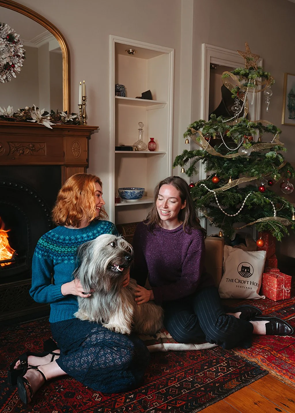 Dougal the Skye Terrier modelling a magenta Donegal jumper for The Croft House