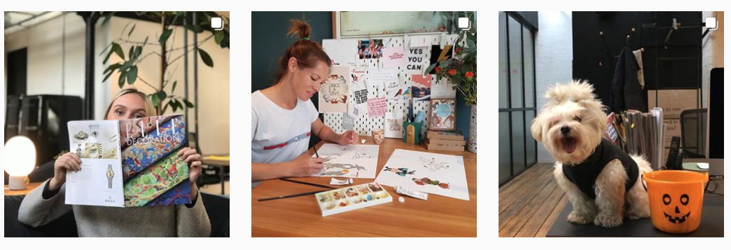 Woman hoding a magazine, woman painting, a white Maltesese terrier dog