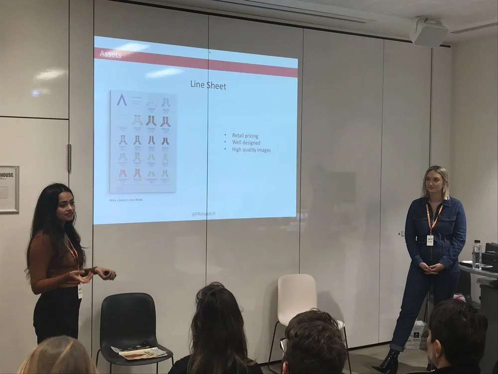 Two women giving a PR  presentation