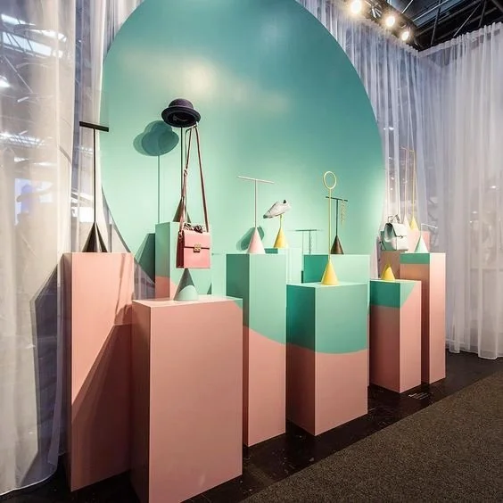 A trade show stand of hats and bags