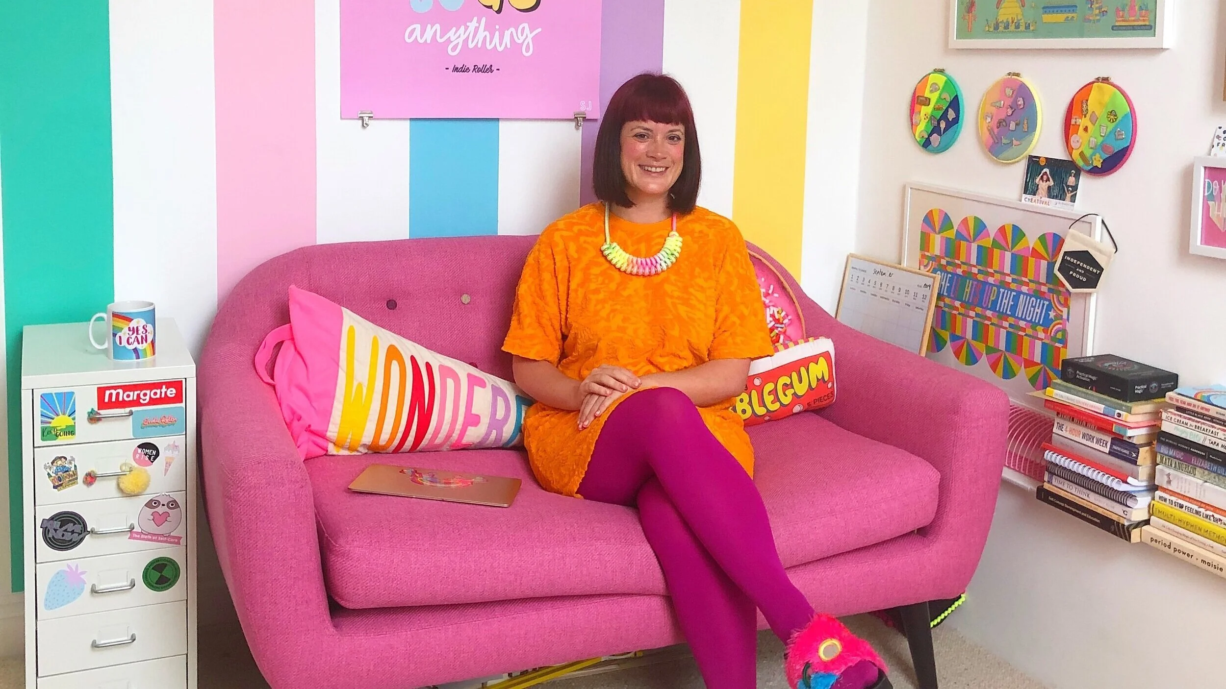 Woman sitting on a pin sofa