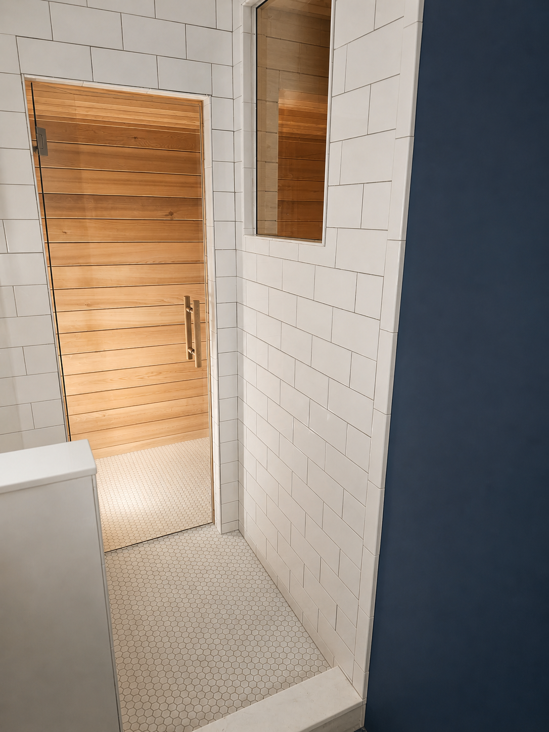 Master bathroom sauna with shower access and clear cedar interior