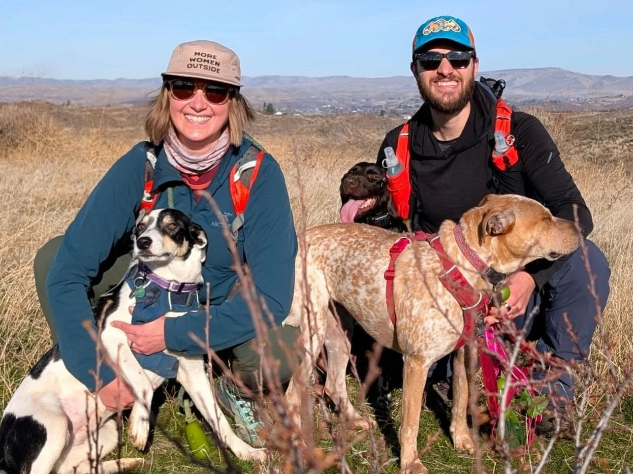 Congratulations to Libby (left) for finding her forever home with humans Courtney and Devin and canine siblings Juve (heeler mix in front) and Kora (Munsterlander behind Devin.) Libby was found as a stray alone and fending for herself when a Good Sam