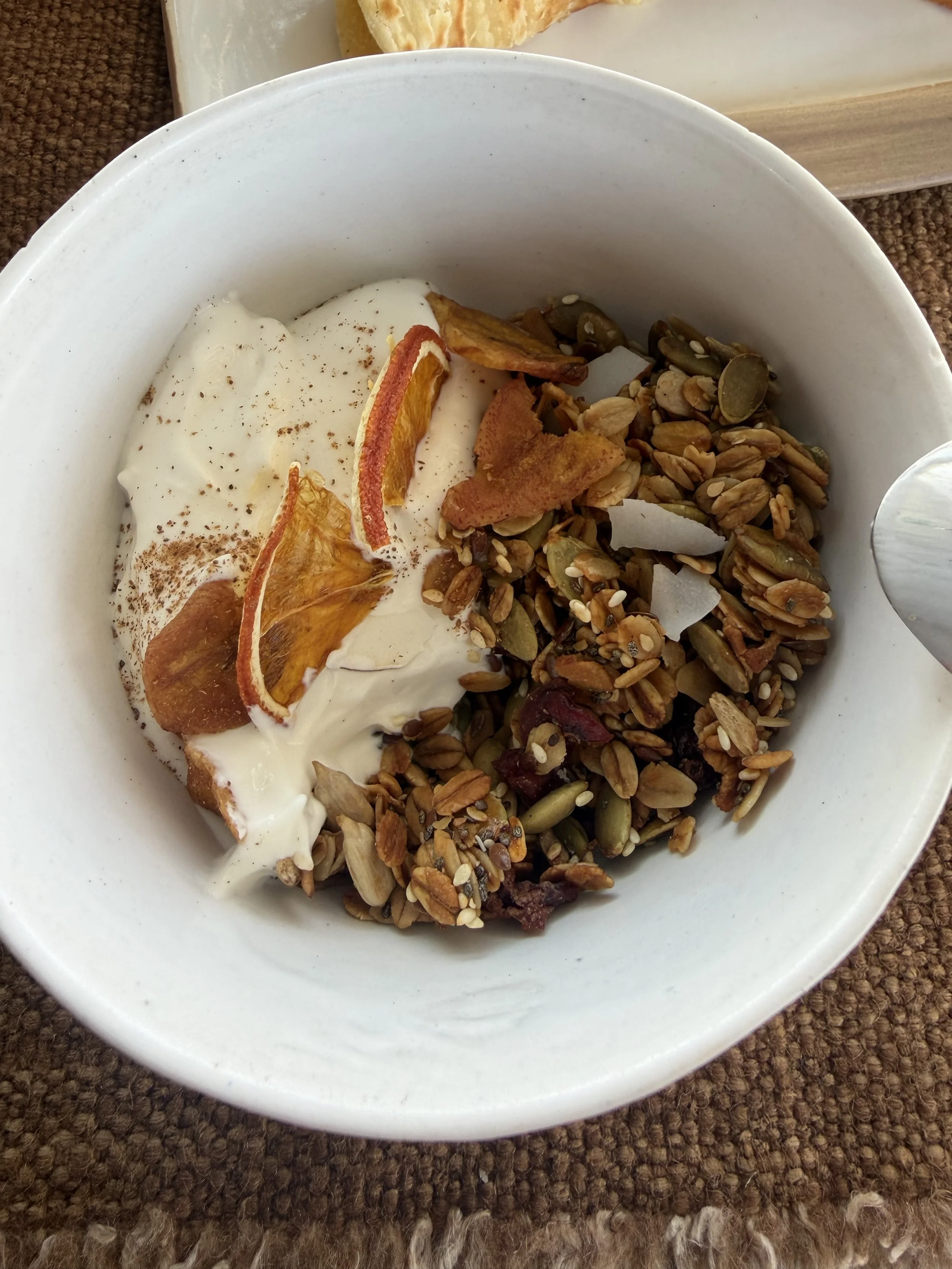 Yogurt with granola and dried fruit at breakfast