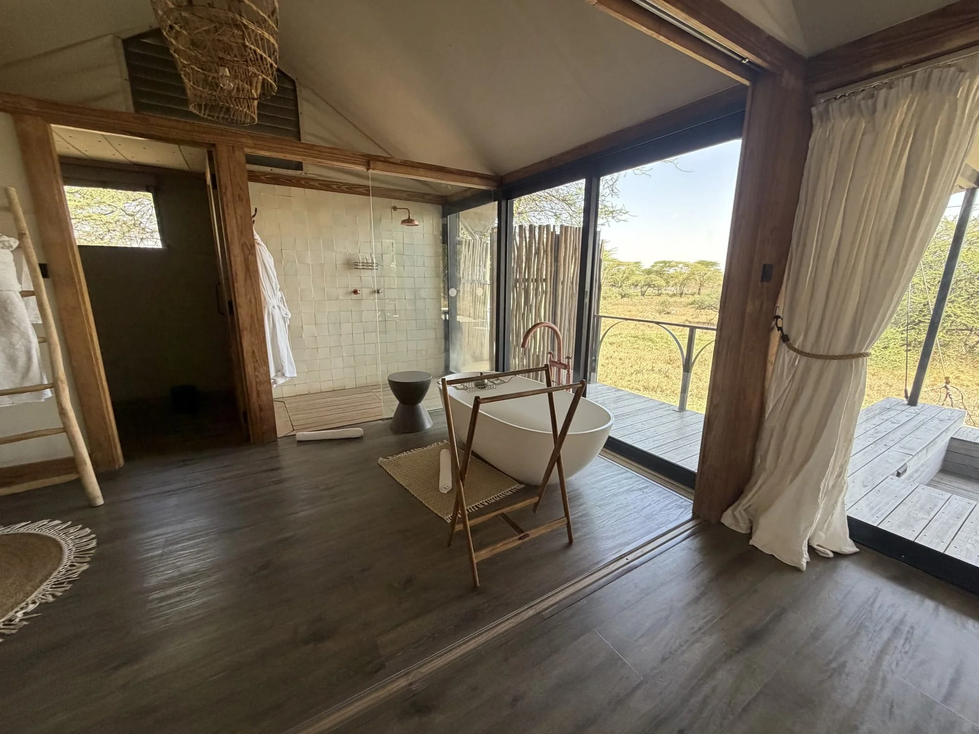 Freestanding tub by the windows in a Lemala Nanyukie suite bathroom