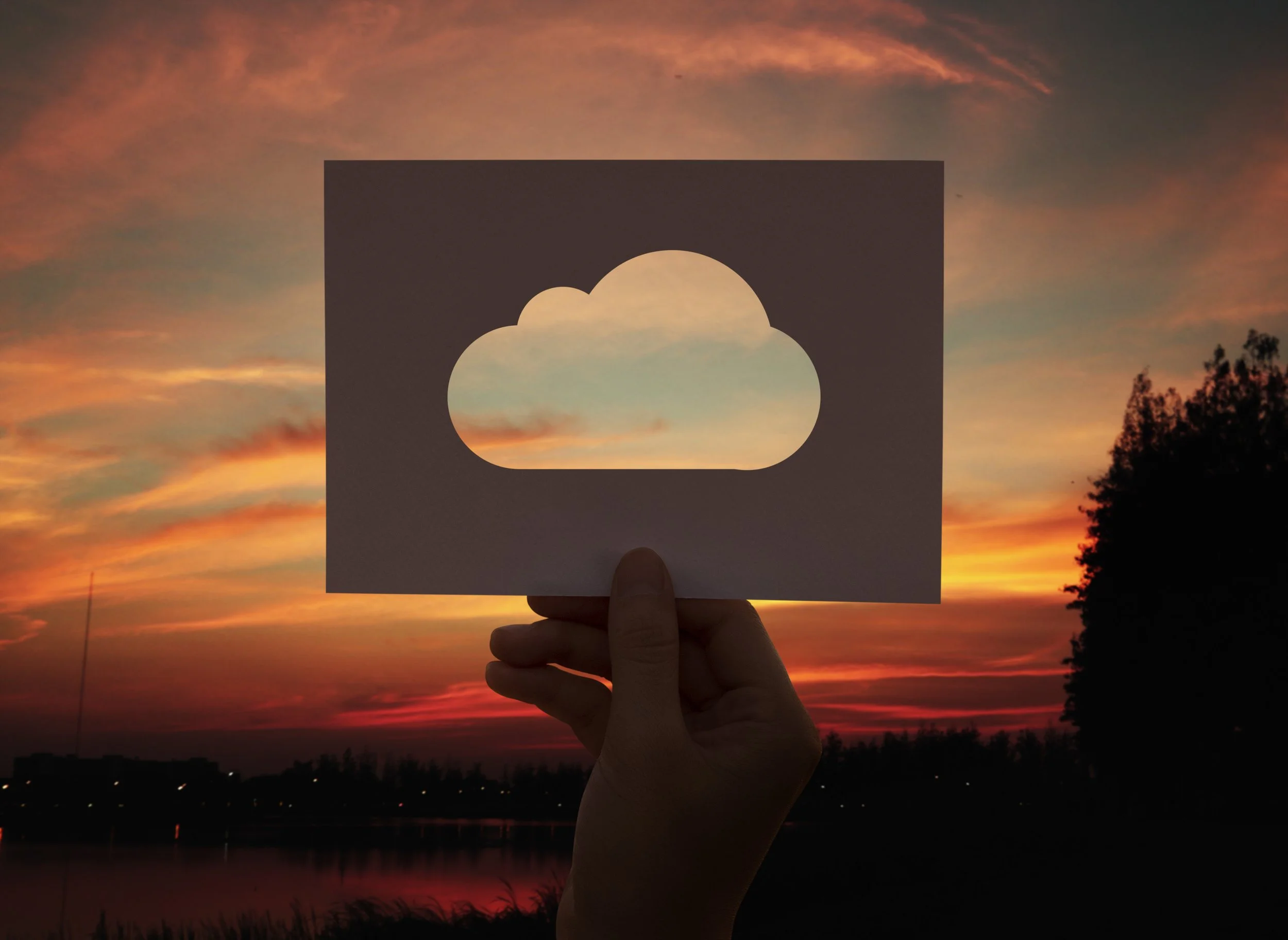 cloud cutout against a sunset backdrop
