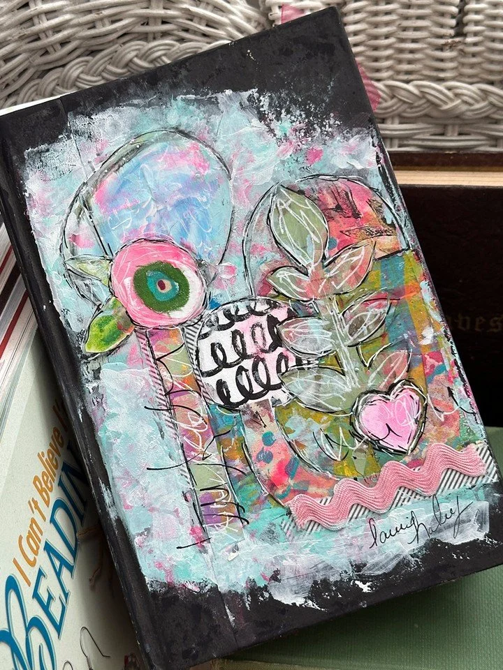 I saved this old book and altered it into a journal. I haven't read the book, but from the words I have seen as I create, honestly...I can see why it was doomed for the trash. 😂 

I have been wanting to cover up the title for a while now, so today I