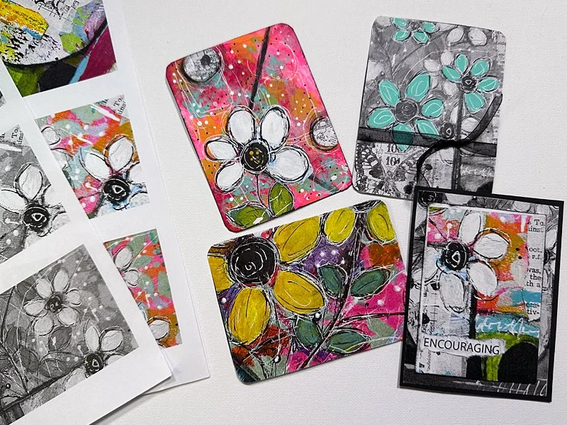 Colorful handmade mixed media artist trading cards featuring whimsical flowers, layered collage papers, and playful details, alongside printable card designs from Many Gifts, One Body for Faith Fest 2027.