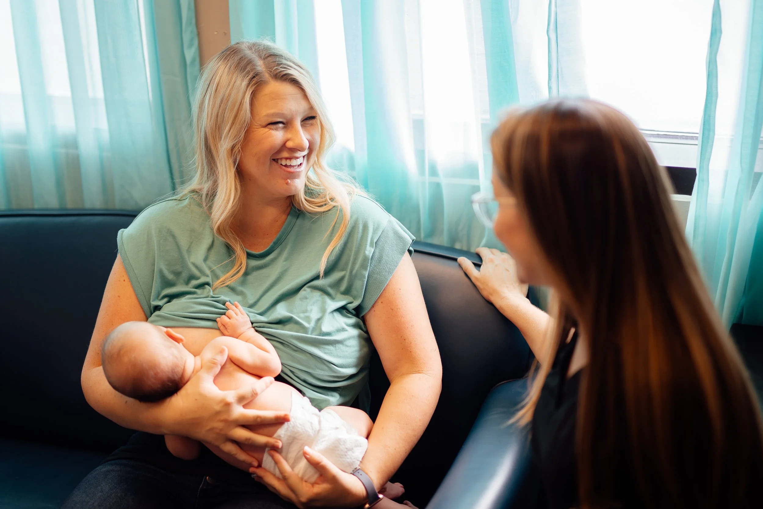 Mom attending in-person lactation consultation